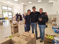Nevo with his parents in the logistics center