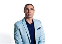 לואיס קופר, מנהל מסחר ראשי ב-Axi - צילום AxiTrader Limited